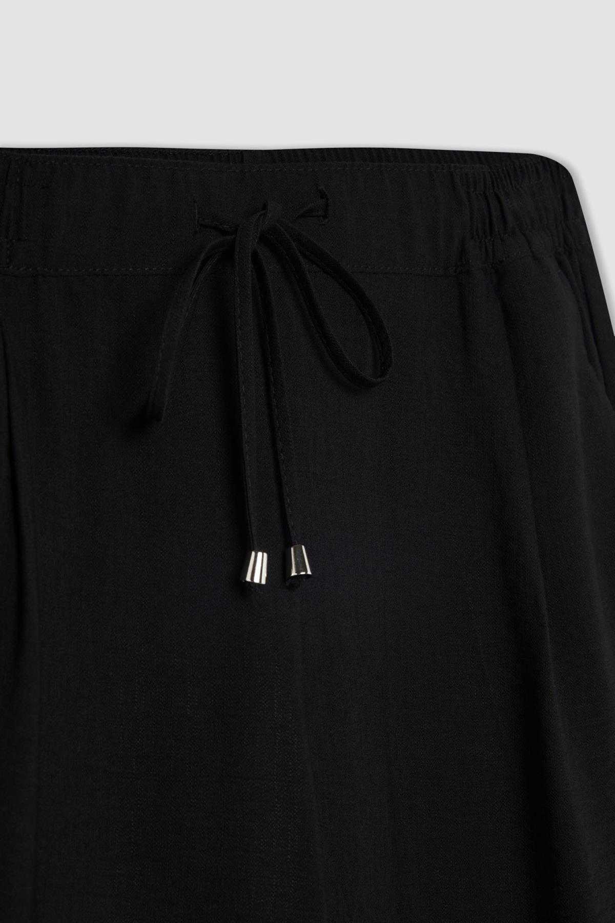 شلوار کتانی کمر بلند با جیب های جاگر