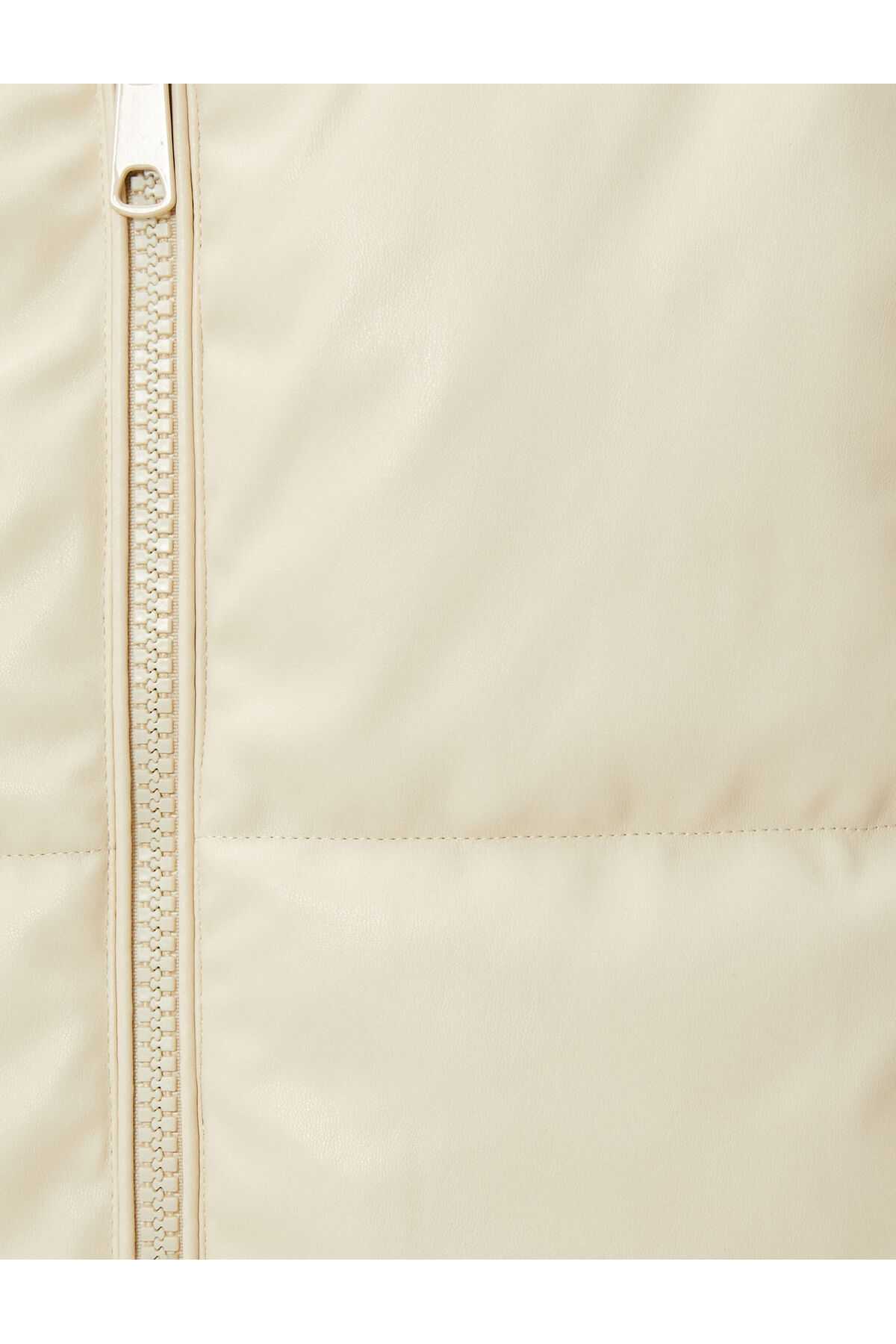 ژاکت پفی قد میدی جیبی کلاهدار