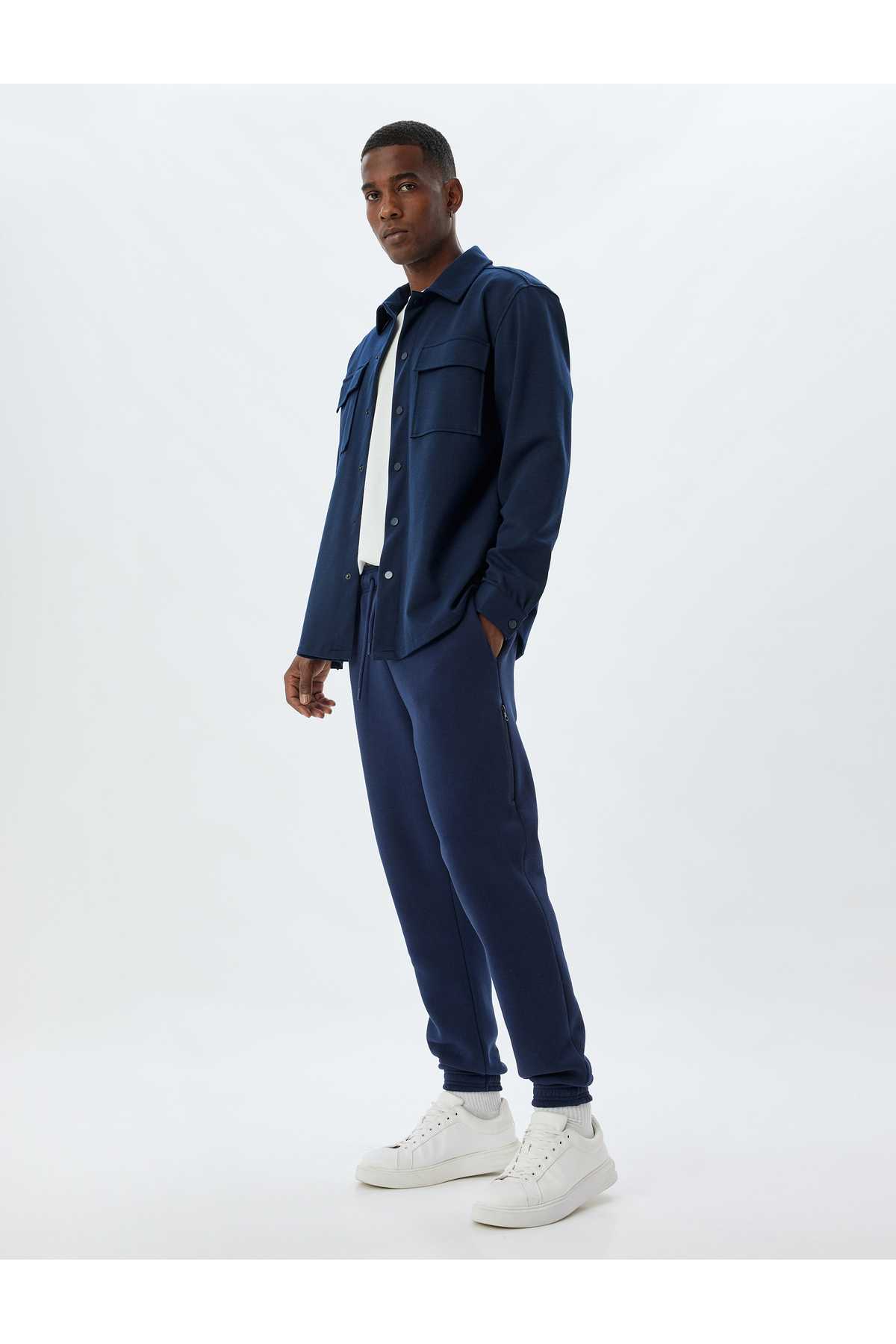 شلوار ورزشی با جیب زیپ کمر توری و ترکیب پنبه