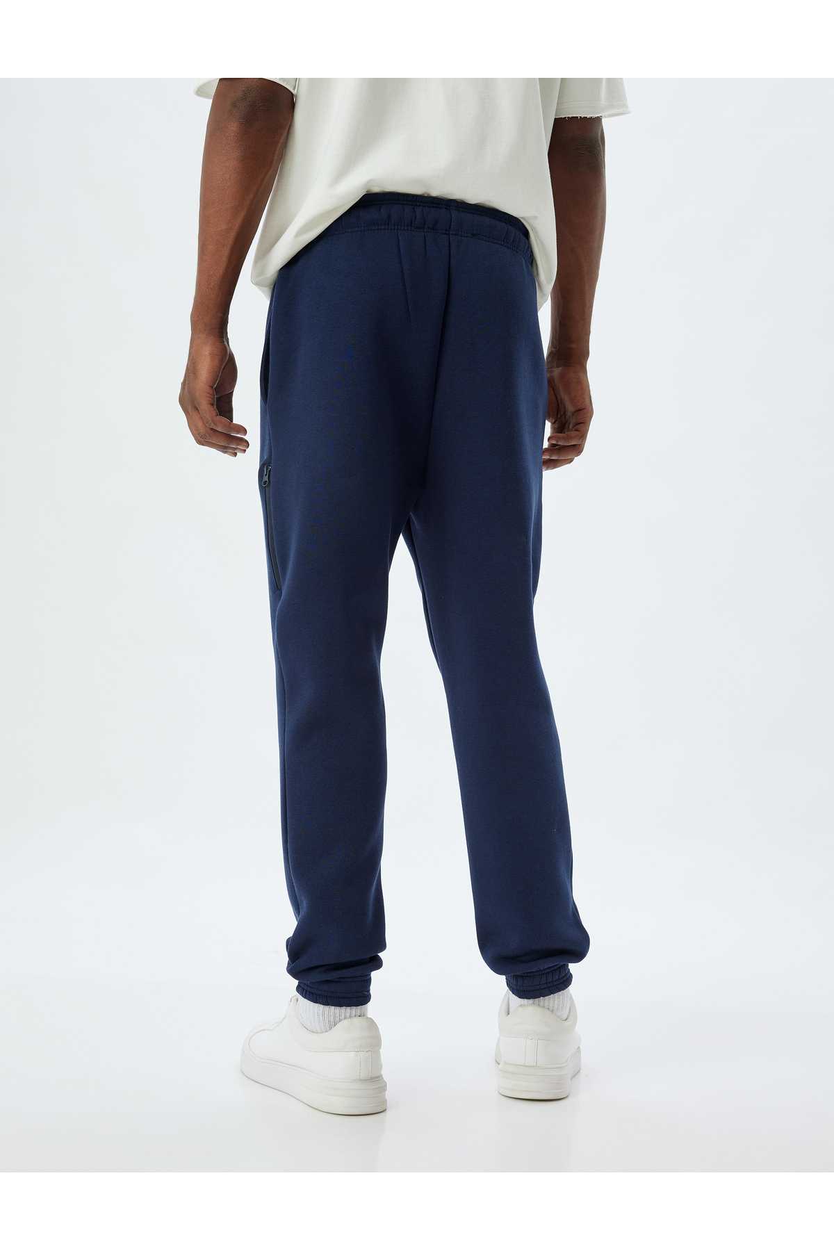 شلوار ورزشی با جیب زیپ کمر توری و ترکیب پنبه